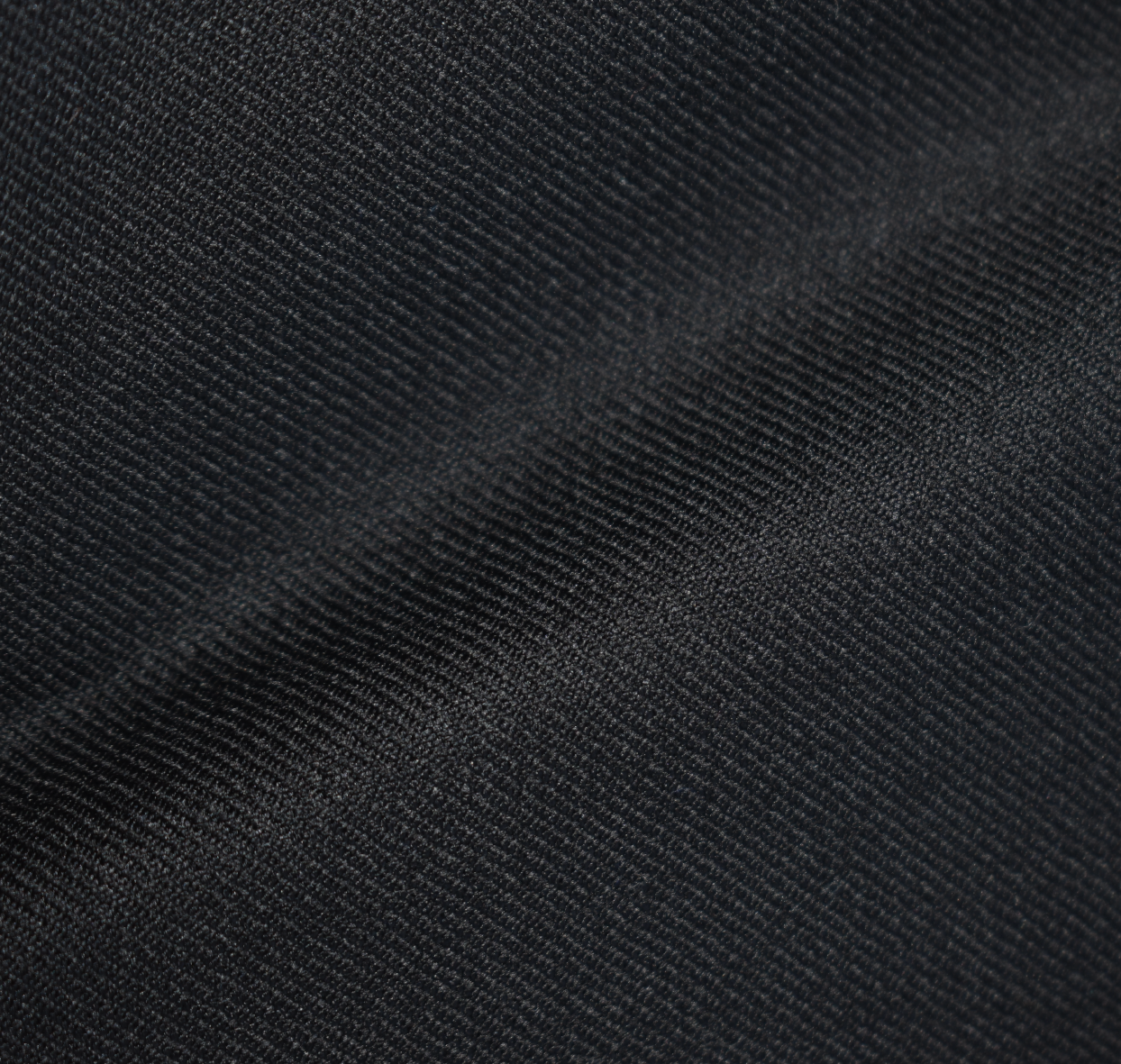 Close-up of black textured wool fabric