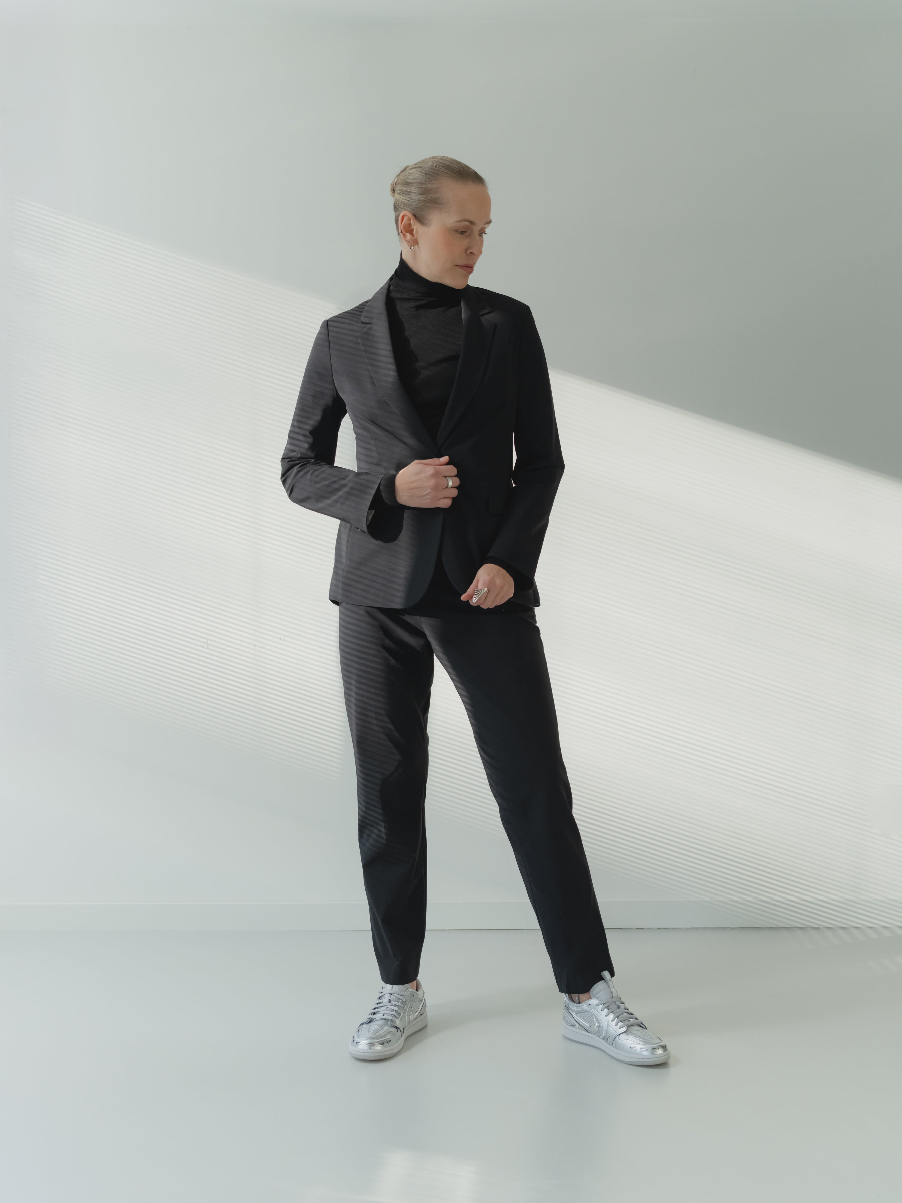 black made to measure women's suit in tech performance fabric by T.G. di Fabio designed by Novem Studio